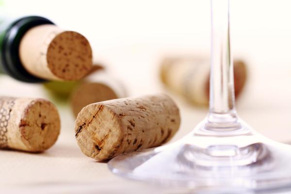 Wine corks, bottle and glass on the table